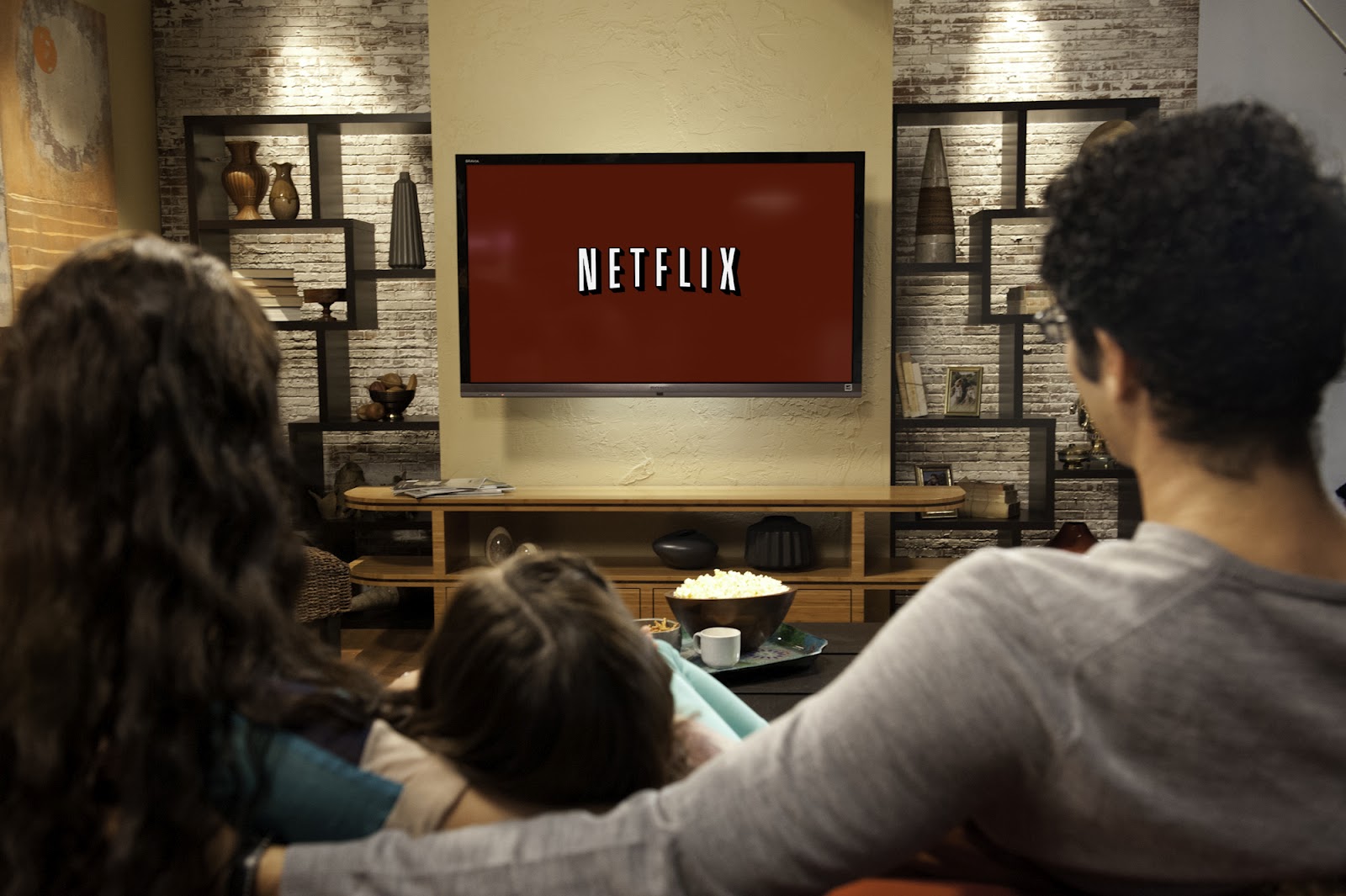 Family in living room 4 - Netflix Logo on Red