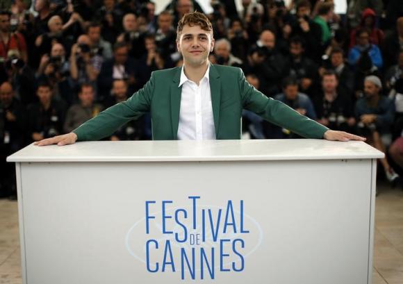 Director Xavier Dolan poses during a photocall for the film "Mommy" in competition at the 67th Cannes Film Festival in Cannes